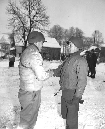 77. At 22nd Tank Bn. ceremony Gen. Kilburn shakes hands with