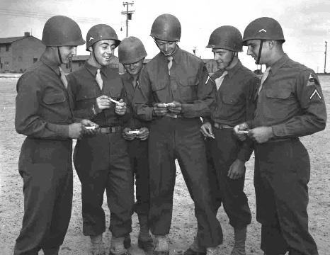707. 21st AIB men look at Expert Infantry Badges.